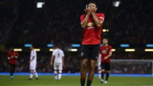 Gelandang serang Manchester United, Jesse Lingard merayakan golnya ke gawang AC Milan pada laga International Champions Cup 2019 (ICC 2019) di Stadion Millennium, Cardiff, Wales, Minggu (4/8/2019) dini hari WIB. [GEOFF CADDICK / AFP]